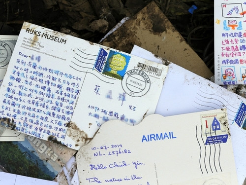马航MH17客机残骸现中文明信片寄件人不在机上(图)